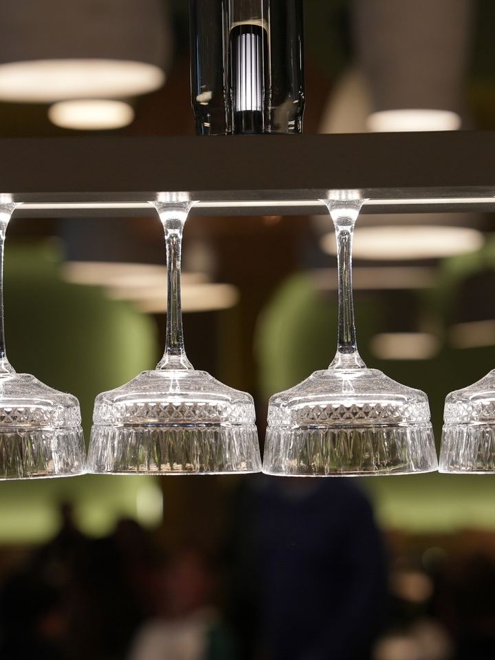 Wine glasses hanging above the bar