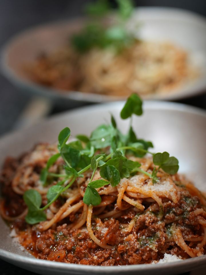 Spaghetti bolognese with grated parmesan