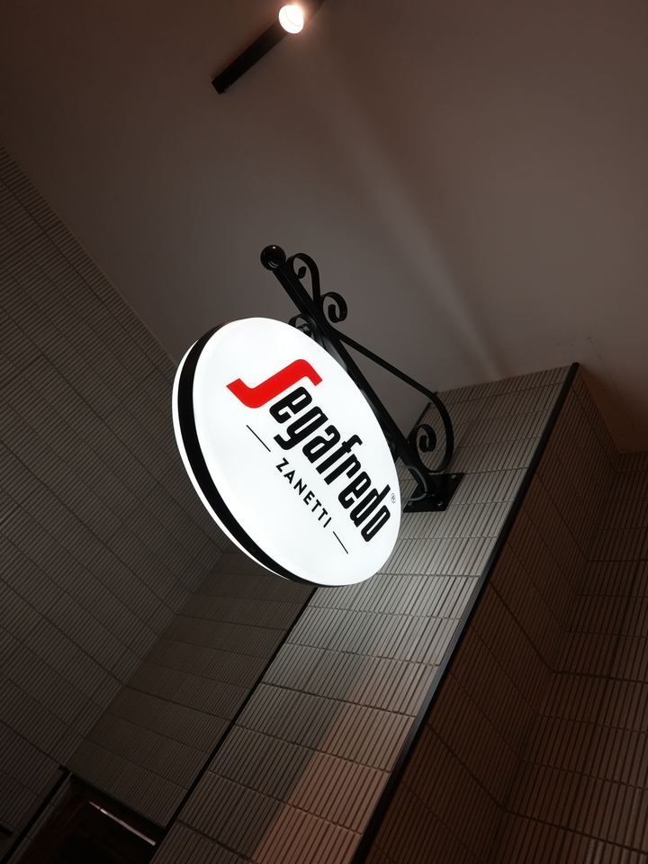 Illuminated coffee sign inside the restaurant